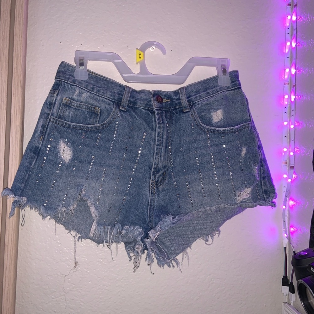 Distressed gemstone denim shorts